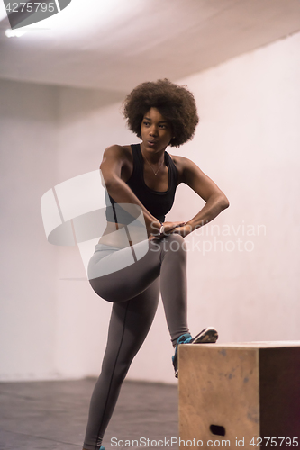 Image of black woman are preparing for box jumps at gym