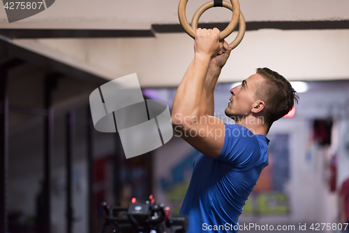 Image of man doing dipping exercise