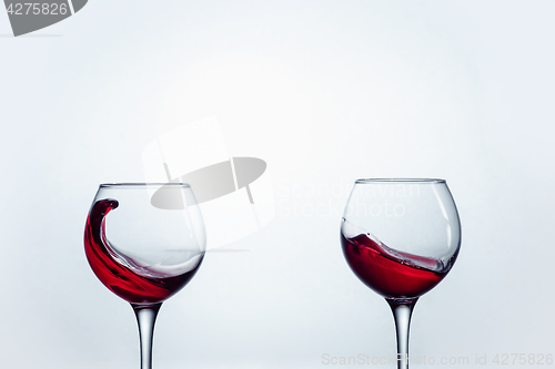 Image of Two wine glasses against white