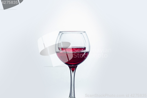 Image of Two wine glasses against white