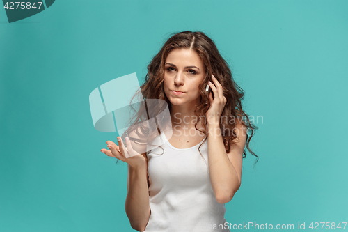 Image of The portrait of disgusted woman with mobile phone