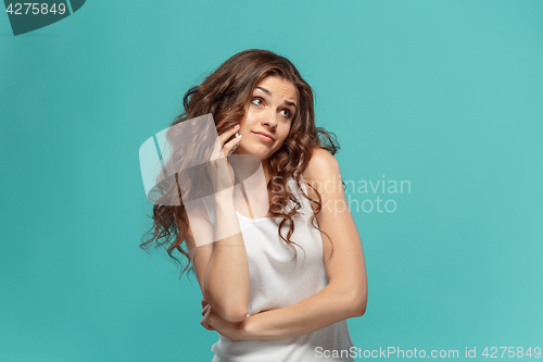 Image of The portrait of disgusted woman with mobile phone