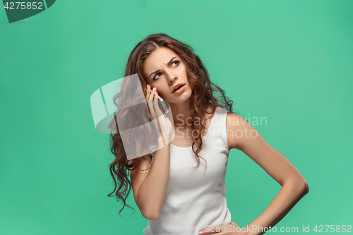 Image of The portrait of disgusted woman with mobile phone