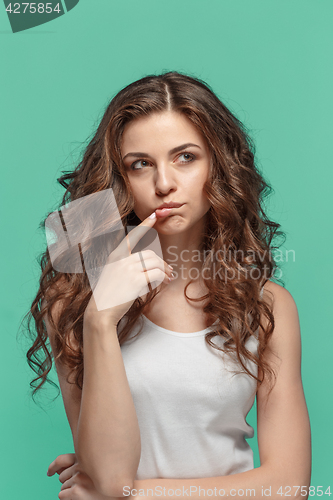 Image of The young woman\'s portrait with thoughtful emotions