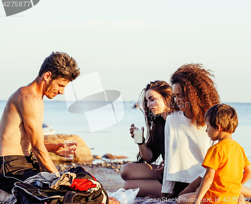 Image of pretty diverse nation and age friends on sea coast having fun, lifestyle people concept on beach vacations 