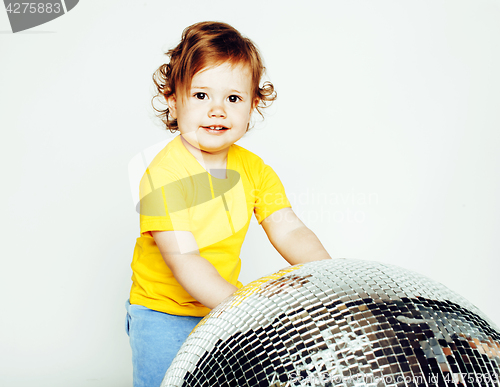 Image of little cute adorable baby girl holding disco ball isolated on white close up, sweet real toddler