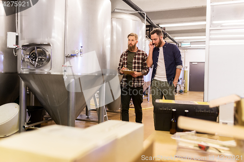 Image of men working at craft brewery or beer plant