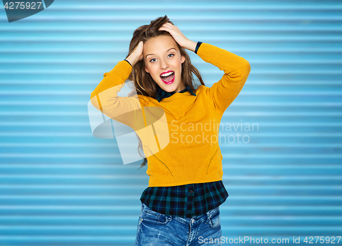 Image of happy young woman or teen girl in casual clothes