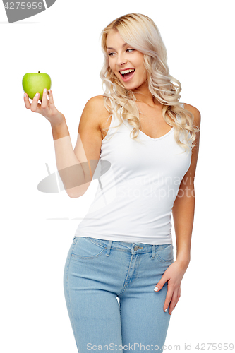 Image of happy beautiful young woman with green apple