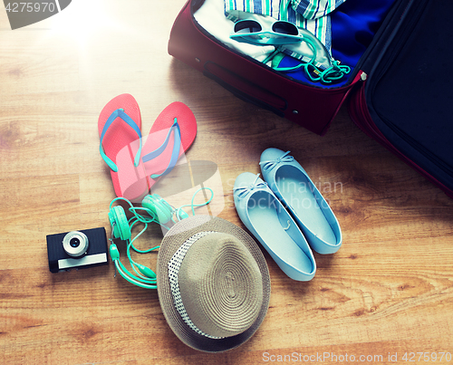 Image of close up of travel bag with clothes and stuff