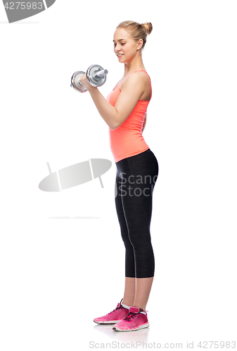 Image of sportive woman flexing muscles with dumbbell