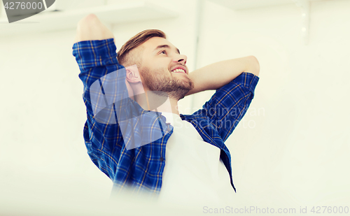 Image of happy creative man with computer at office