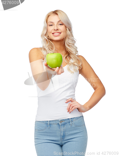 Image of happy beautiful young woman with green apple