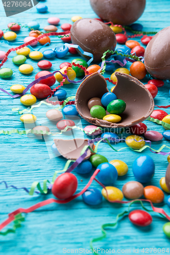 Image of Sweets, chocolate eggs, colorful ribbons