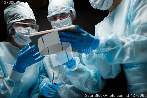 Image of Doctors with computer in hands