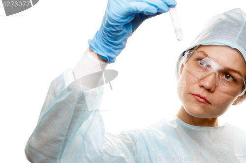 Image of Lab assistant looks at tube