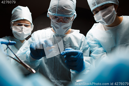 Image of Photo of doctors with instruments