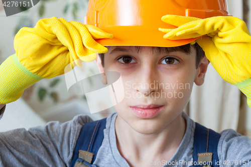 Image of boy in a construction helmet