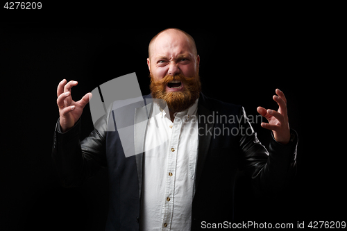 Image of Screaming man with tense hands with ginger beard and mustache on empty fern background