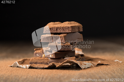 Image of Milk chocolate on wooden table