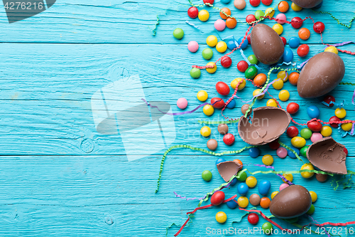 Image of Candy, chocolate eggs, colorful ribbons