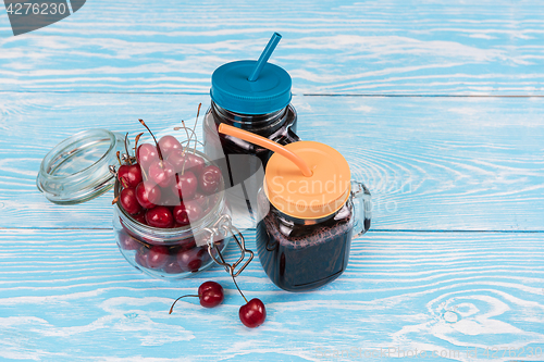 Image of Cherry juice with glass of berries