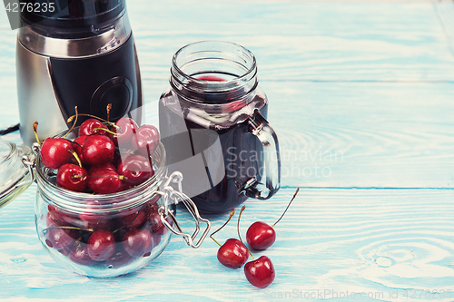 Image of Cherry juice with glass of berries