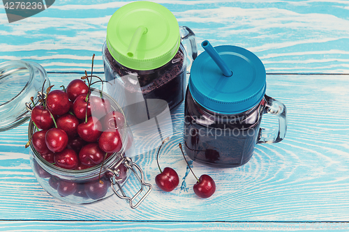 Image of Cherry juice with glass of berries