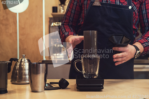 Image of Barista brewing aeropress coffee