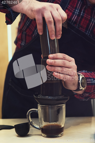 Image of Barista brewing aeropress coffee