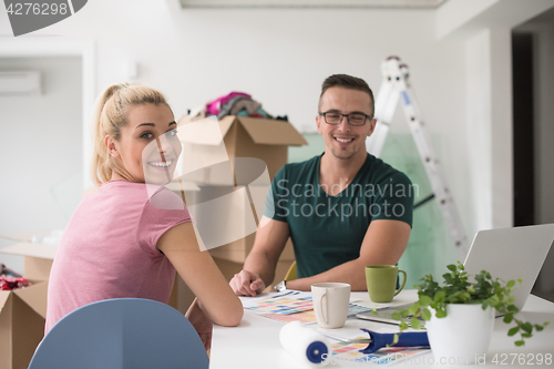 Image of Young couple moving in a new home