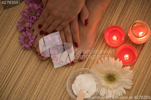 Image of female feet and hands at spa salon