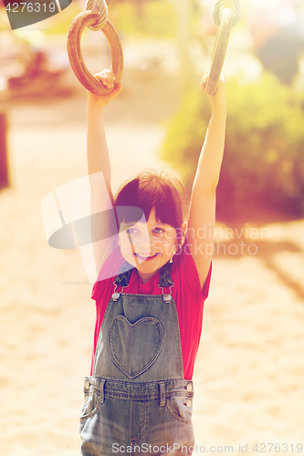 Image of happy little girl on children playground