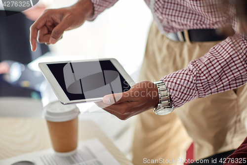 Image of businessman with tablet pc at office
