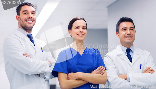 Image of happy group of medics or doctors at hospital