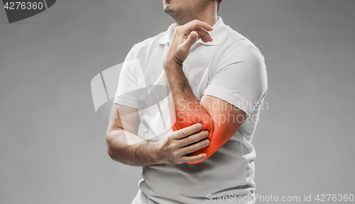 Image of close up of man suffering from pain in hand