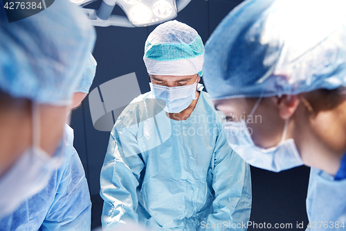 Image of group of surgeons in operating room at hospital