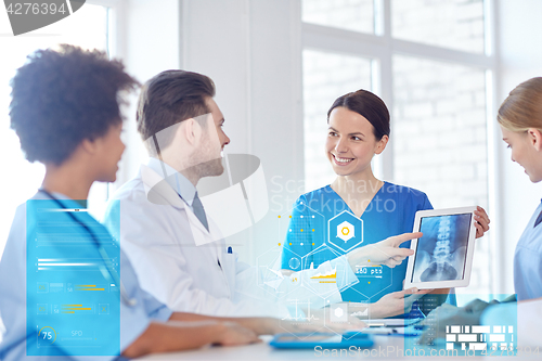 Image of group of happy doctors meeting at hospital office