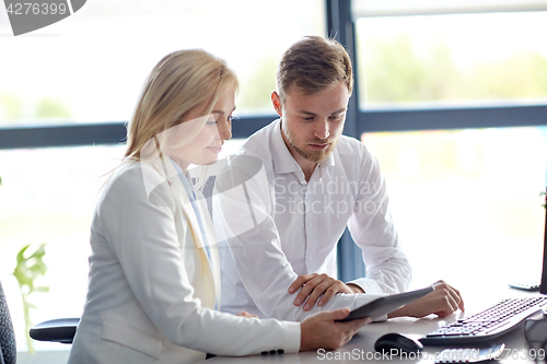 Image of business team with tablet pc computer at office