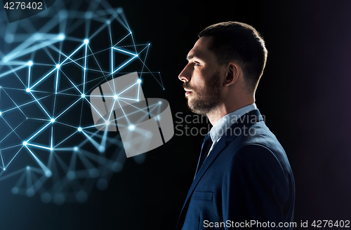 Image of businessman looking at network virtual projection