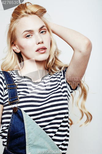 Image of young pretty stylish hipster girl posing emotional isolated on white background happy smiling cool smile, lifestyle people concept