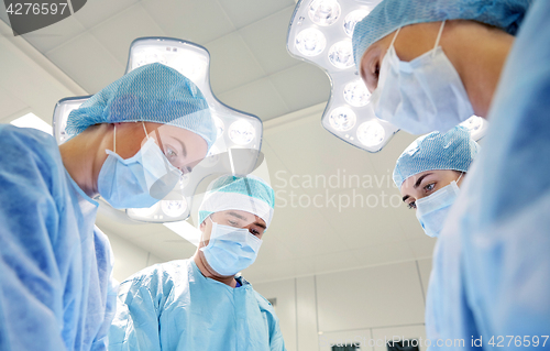 Image of group of surgeons in operating room at hospital