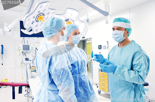 Image of group of surgeons in operating room at hospital