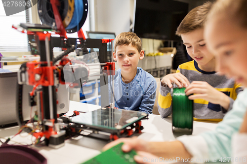 Image of happy children with 3d printer at robotics school