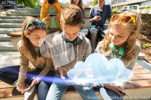 Image of happy teenage friends with smartphones outdoors