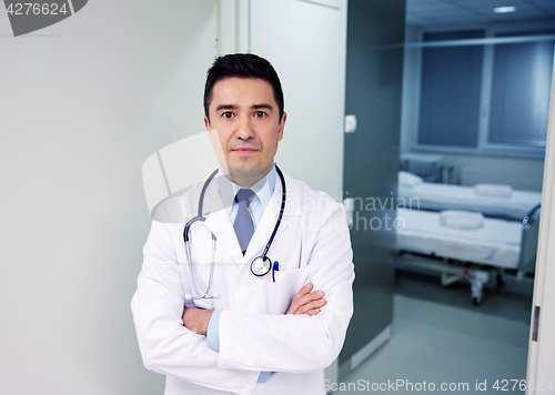 Image of doctor with stethoscope at hospital corridor