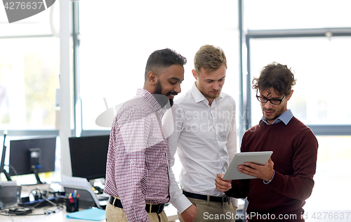 Image of business team with tablet pc at office