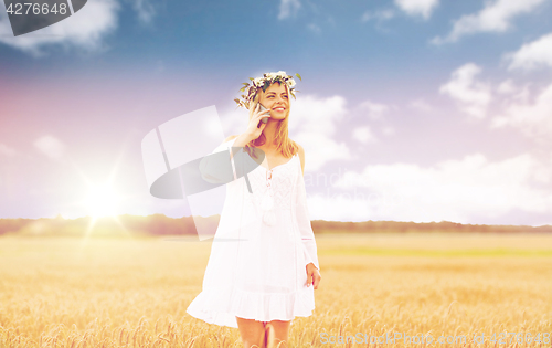 Image of happy young woman calling on smartphone at country