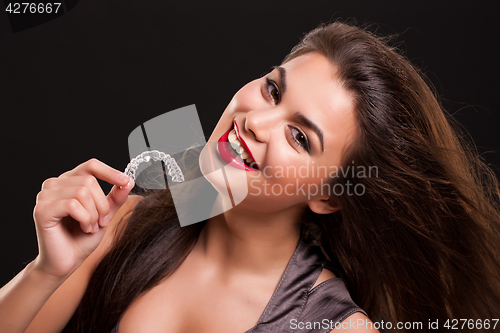 Image of Young Beautiful Smiling Woman With Dental Braces