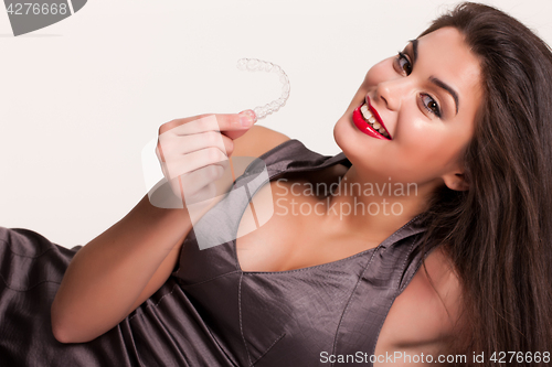 Image of Young Beautiful Smiling Woman With Dental Braces